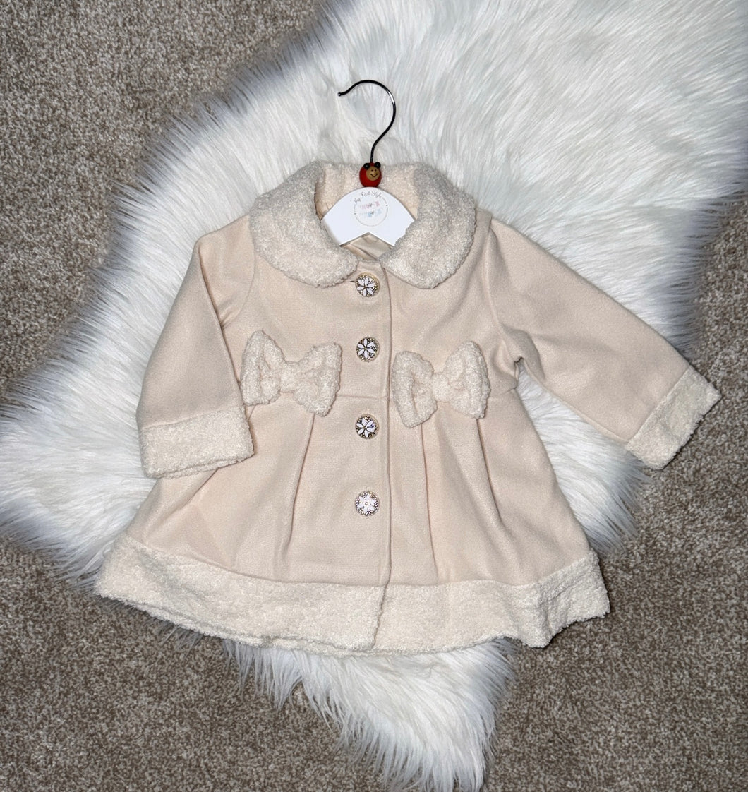 Beige bow coat