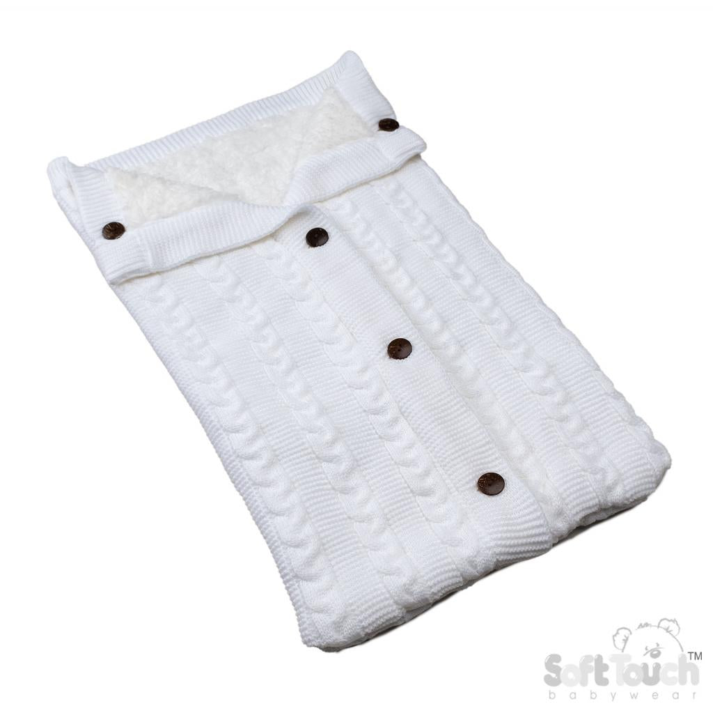 White fur lined knitted pram blanket