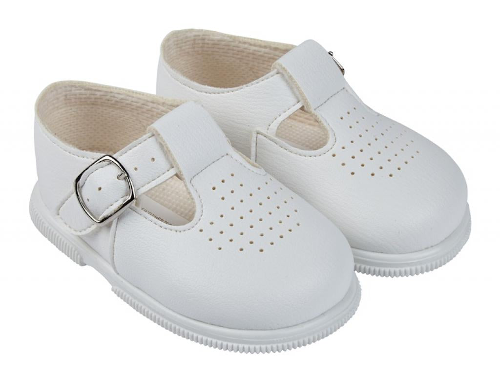 White hard soled shoes