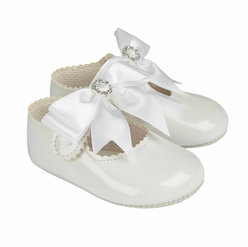 Soft soled diamanté white bow shoes